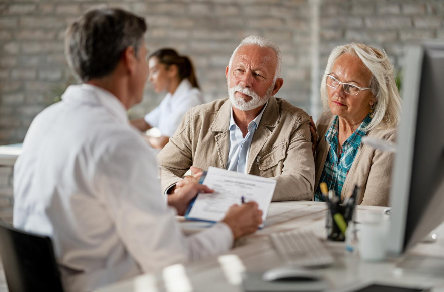 Older couple reviewing coverage to understand how insurance needs change with age
