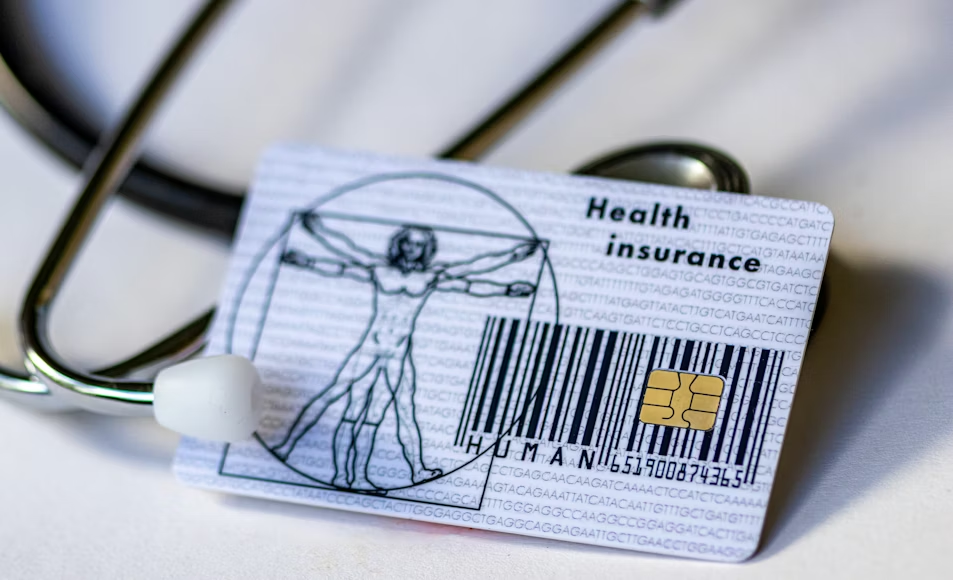 Health insurance card and stethoscope illustrating health insurance plans explained