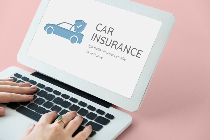 Person researching what auto insurance coverage do I need on a laptop screen